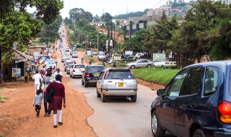 Education in Uganda Lead Image: Photo showing a street crowded with pedestrians and motor vehicles in Uganda