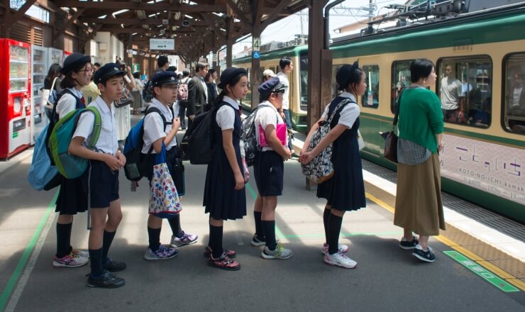 Education in Japan Lead Image: Photo of Japanese students at a train station